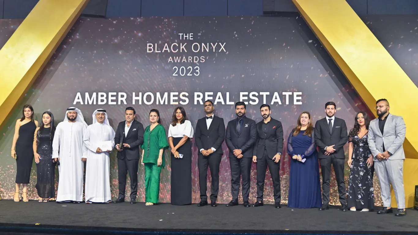 Ambreen Qureshi and the Amber Homes Real Estate team on stage — Platinum Agency 2023