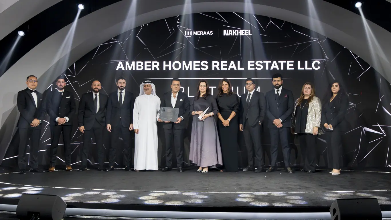 Ambreen Qureshi and the Amber Homes Real Estate team on stage — Platinum Agency 2024